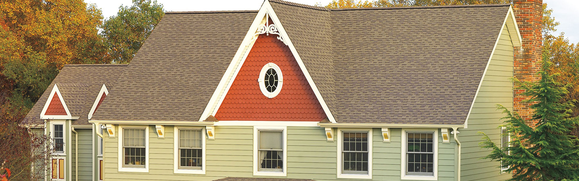Home with a brown shingle roof